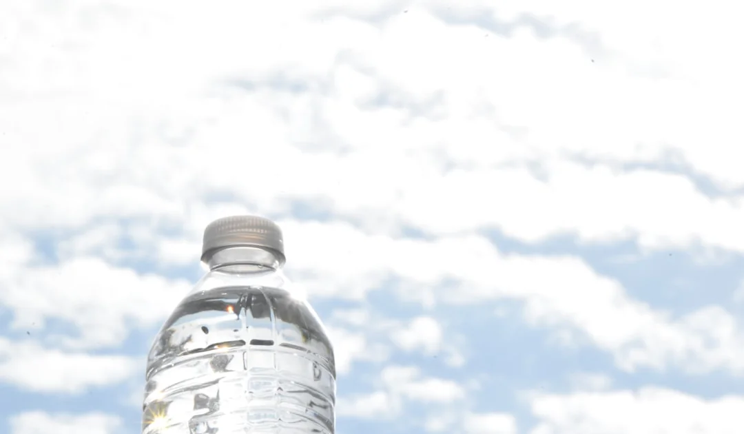 bottle of water on a table outside